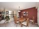Bright dining room features a large window, tile flooring, and traditional furnishings at 6945 E Cochise E Rd # 117, Paradise Valley, AZ 85253