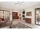 Bright and airy living area with fireplace, tile flooring, and access to dining area at 6945 E Cochise E Rd # 117, Paradise Valley, AZ 85253
