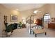 Bright primary bedroom with four poster bed, plants, and fireplace at 6945 E Cochise E Rd # 117, Paradise Valley, AZ 85253