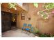 Secluded patio with small seating area and outdoor decor at 6945 E Cochise E Rd # 117, Paradise Valley, AZ 85253