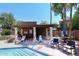 Community pool with sun loungers under a pergola providing a resort style outdoor retreat at 6945 E Cochise E Rd # 117, Paradise Valley, AZ 85253