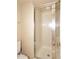 Compact bathroom shower with glass door and grab bar at 6945 E Cochise E Rd # 117, Paradise Valley, AZ 85253