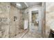 Contemporary bathroom boasts a glass-enclosed shower, stylish fixtures, and stone flooring at 7131 E Rancho Vista Dr # 7011, Scottsdale, AZ 85251