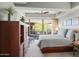 Comfortable bedroom featuring a plush bed, large windows, and elegant furniture at 7131 E Rancho Vista Dr # 7011, Scottsdale, AZ 85251