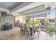 Elegant dining room featuring a glass table, modern chairs, and large windows at 7131 E Rancho Vista Dr # 7011, Scottsdale, AZ 85251