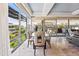 Bright dining area with floor-to-ceiling windows, a glass table, and modern chairs at 7131 E Rancho Vista Dr # 7011, Scottsdale, AZ 85251