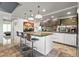 Modern kitchen with granite countertops, stainless steel appliances, and bar stool seating at 7131 E Rancho Vista Dr # 7011, Scottsdale, AZ 85251