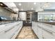 Sleek kitchen with white cabinetry, granite countertops, and stainless steel appliances at 7131 E Rancho Vista Dr # 7011, Scottsdale, AZ 85251