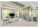 Relaxing living room space with comfortable seating, a TV, and scenic views from large windows at 7131 E Rancho Vista Dr # 7011, Scottsdale, AZ 85251