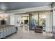 Expansive main bedroom with stone floors, a seating area, and glass doors to a private balcony at 7131 E Rancho Vista Dr # 7011, Scottsdale, AZ 85251