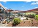 Inviting patio featuring stylish outdoor furniture and beautiful landscaping with cacti, stones and views at 7131 E Rancho Vista Dr # 7011, Scottsdale, AZ 85251