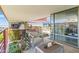 Comfortable rooftop deck with seating, desert landscaping, and glass views to neighboring buildings at 7131 E Rancho Vista Dr # 7011, Scottsdale, AZ 85251