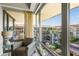 Charming sitting area with large windows showcasing a lovely view at 7131 E Rancho Vista Dr # 7011, Scottsdale, AZ 85251
