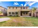 The expansive backyard has a lush lawn, patio, and mature trees at 7220 W Ashby Dr, Peoria, AZ 85383