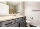 Bathroom featuring gray vanity with light countertops, modern fixtures, and a toilet at 7220 W Ashby Dr, Peoria, AZ 85383