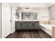 Well-lit bathroom with a double sink vanity and large framed mirror at 7220 W Ashby Dr, Peoria, AZ 85383