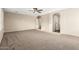 A Large bedroom featuring neutral walls, plush carpeting, and an open doorway at 7220 W Ashby Dr, Peoria, AZ 85383