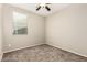 Bedroom featuring neutral walls, plush carpeting, and a ceiling fan at 7220 W Ashby Dr, Peoria, AZ 85383