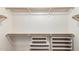 Walk-in closet with ample shelving and rod space for storage at 7220 W Ashby Dr, Peoria, AZ 85383