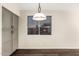 Dining area showcasing gray cabinets, a window with blinds, and stylish pendant lighting at 7220 W Ashby Dr, Peoria, AZ 85383