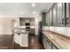 Well-lit kitchen featuring granite countertops, gray cabinets, and stainless steel appliances at 7220 W Ashby Dr, Peoria, AZ 85383