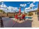 Backyard pool boasts an inviting outdoor seating area surrounded by lush landscaping and clear, sunny skies at 7604 N 46Th Ave, Glendale, AZ 85301