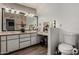 Bathroom features a large vanity, and a seperate makeup vanity at 7604 N 46Th Ave, Glendale, AZ 85301