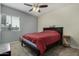 Cozy bedroom with ceiling fan and window at 7604 N 46Th Ave, Glendale, AZ 85301