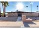 Stunning exterior showcasing mid-century modern design, desert landscaping, and a welcoming walkway to the front door at 7604 N 46Th Ave, Glendale, AZ 85301