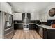 Updated kitchen featuring modern stainless steel appliances and contrasting cabinetry at 7604 N 46Th Ave, Glendale, AZ 85301