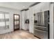 Kitchen features stainless steel appliances and ample white cabinetry at 7604 N 46Th Ave, Glendale, AZ 85301