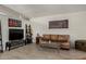 Living room features white brick wall, tile floors, and comfortable seating at 7604 N 46Th Ave, Glendale, AZ 85301