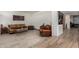 Inviting living room featuring leather seating, tile floors, and a stylish coffee table at 7604 N 46Th Ave, Glendale, AZ 85301