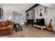 Comfortable living room featuring a brick fireplace and stylish decor at 7604 N 46Th Ave, Glendale, AZ 85301