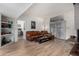 Open living room with comfortable leather seating, fireplace, and built-in shelves at 7604 N 46Th Ave, Glendale, AZ 85301