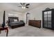 Spacious main bedroom featuring a large bed, ceiling fan, and ample natural light at 7604 N 46Th Ave, Glendale, AZ 85301
