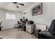 Bright home office with brick accent wall, large window, and ample workspace for productivity at 7604 N 46Th Ave, Glendale, AZ 85301