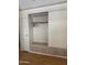 Bedroom closet with sliding doors and custom built-in shelving at 7750 E Broadway Rd # 604, Mesa, AZ 85208