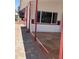 Inviting outdoor space with a red-trimmed awning and unique stained concrete at 7750 E Broadway Rd # 604, Mesa, AZ 85208
