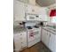 Bright kitchen featuring white cabinets, granite countertops, and updated appliances at 7750 E Broadway Rd # 604, Mesa, AZ 85208