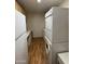 Practical laundry area with stacked washer and dryer, storage cabinets and counter space at 7750 E Broadway Rd # 604, Mesa, AZ 85208