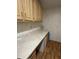 Laundry room with ample cabinet and countertop space, perfect for organization and projects at 7750 E Broadway Rd # 604, Mesa, AZ 85208