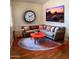 Inviting living room featuring a cozy sectional sofa, round rug, and decorative artwork at 7750 E Broadway Rd # 604, Mesa, AZ 85208
