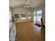 Bright living room featuring wood floors, sliding glass doors to the porch and ample natural light at 7750 E Broadway Rd # 604, Mesa, AZ 85208