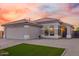 Charming single-story home with desert landscaping, a tiled roof, and a spacious two-car garage at 7838 N 110 Ln, Glendale, AZ 85307