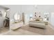 Bright main bedroom featuring a walk-in closet, ensuite bathroom, and calming contemporary decor at 7838 N 110 Ln, Glendale, AZ 85307