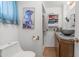 Modern bathroom with unique bowl sink, granite countertop, cabinet, and shower behind the toilet at 786 Cinnabar Dr, Apache Junction, AZ 85119