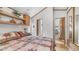 Cozy bedroom with quilted bed, wood look floors, and overhead storage at 786 Cinnabar Dr, Apache Junction, AZ 85119