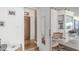 Bright entryway featuring laminate wood floors, white walls, and access to the sunroom at 786 Cinnabar Dr, Apache Junction, AZ 85119