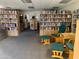 Shelves of books, plus seating, in the community library at Golden Vista Resort at 786 Cinnabar Dr, Apache Junction, AZ 85119